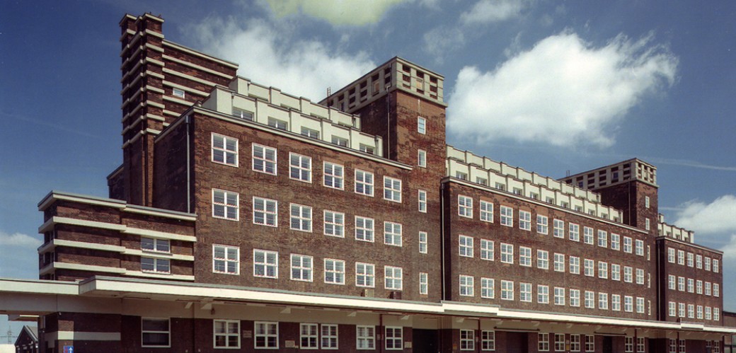 View of a large, winding building made of red bricks